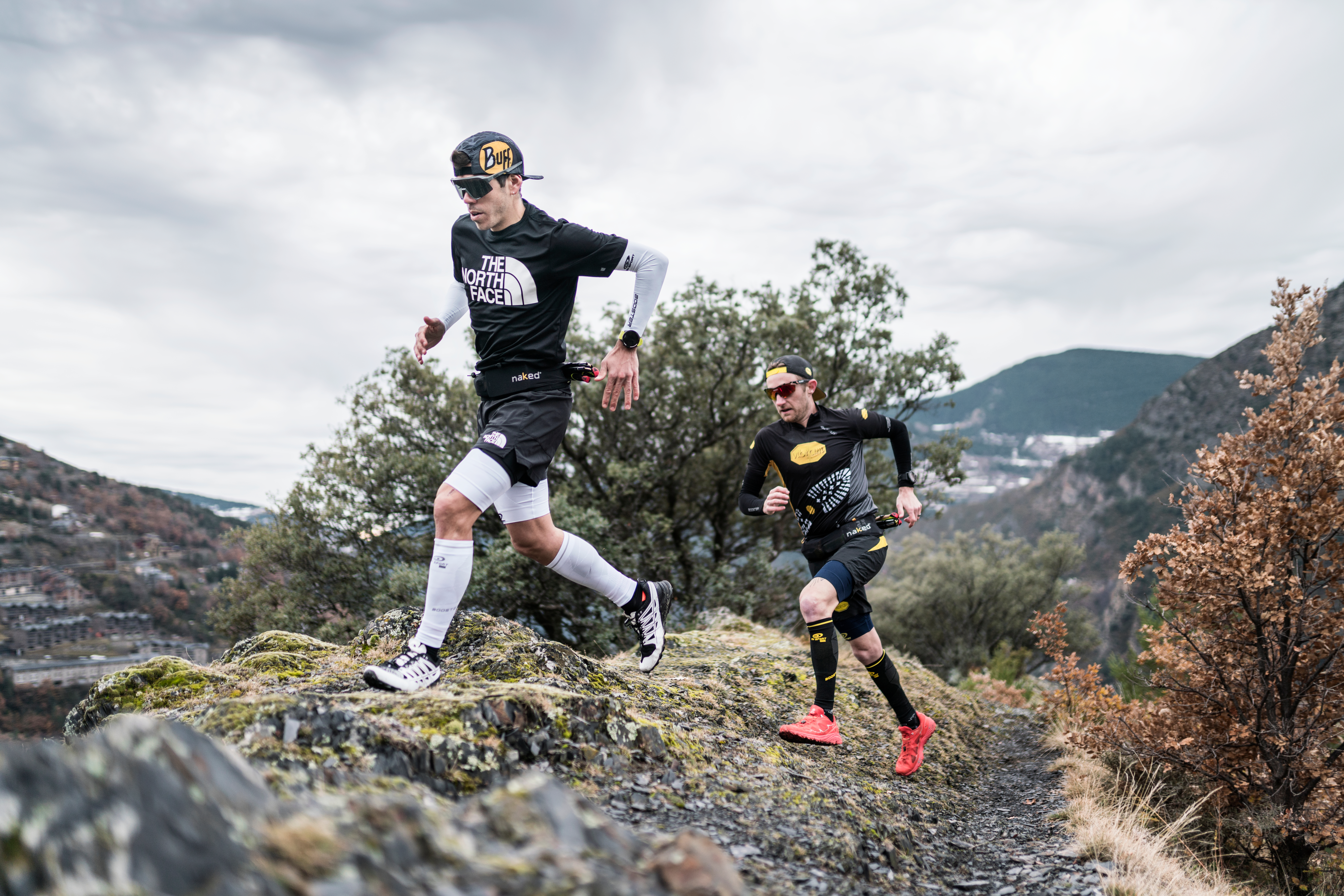 a runner wearing a naked band moving through high mountain terrain