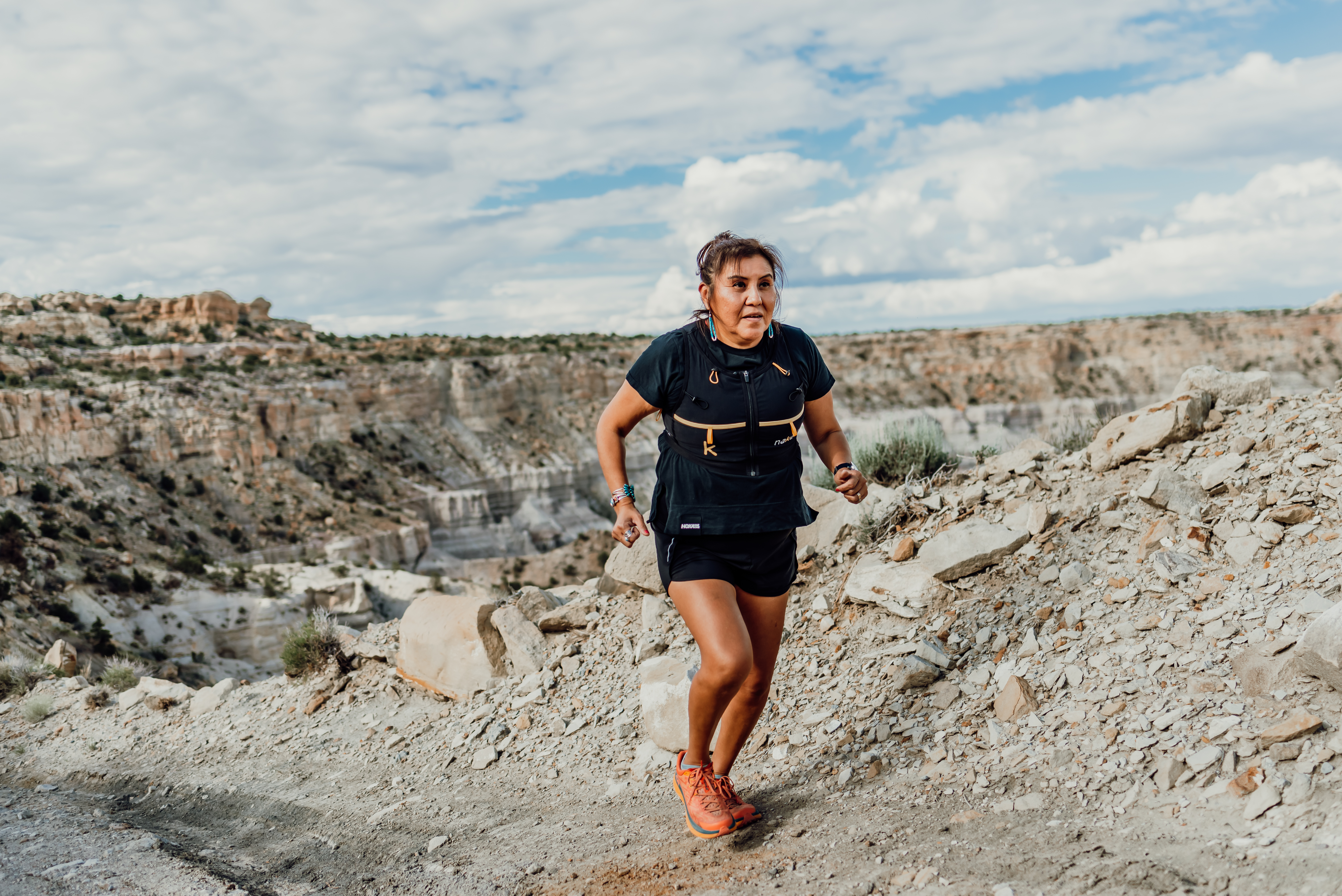 verna volker, founder of native women running, running on open rocky terrain