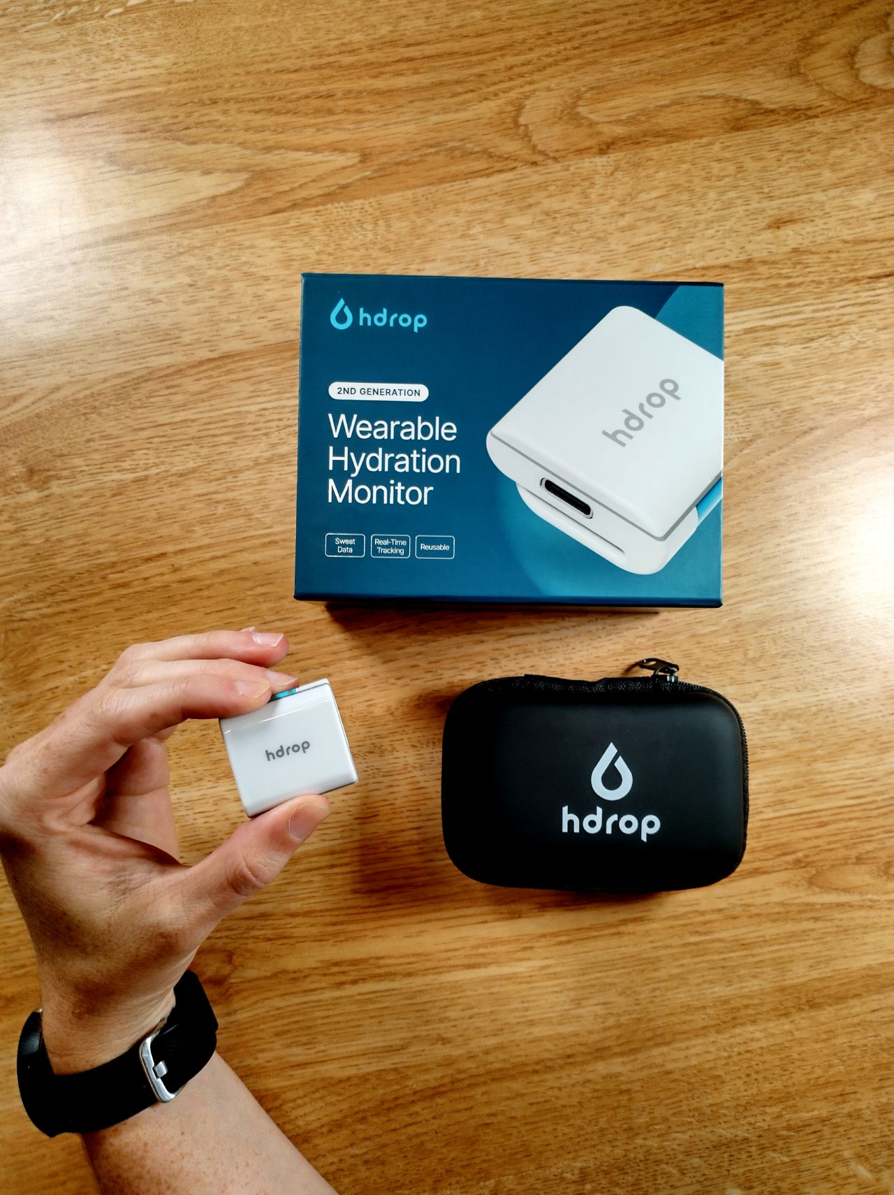the hdrop gen 2 sweat sensor, a small square unit worn on the upper arm