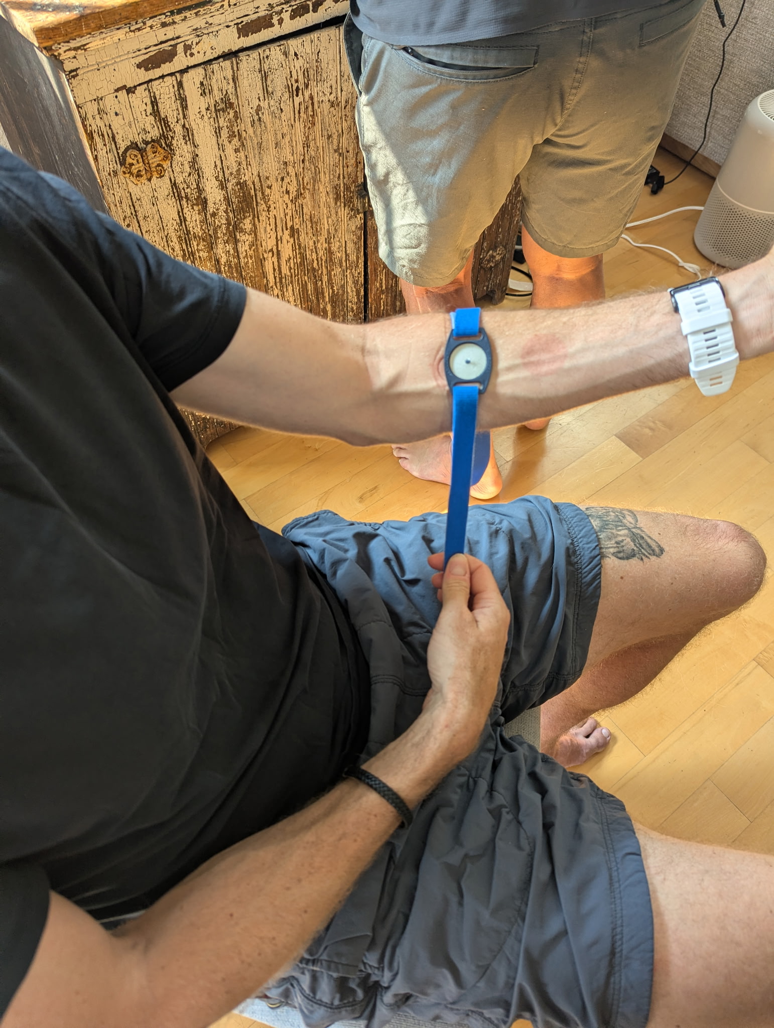 graham wearing the sweat collection sensors on his arm during a precision sweat test