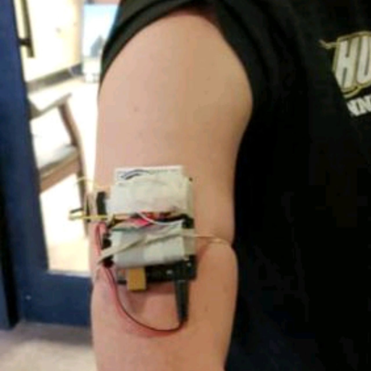 the earliest hdrop prototype, a bicep-sized circuit board held to a forearm with rubber bands