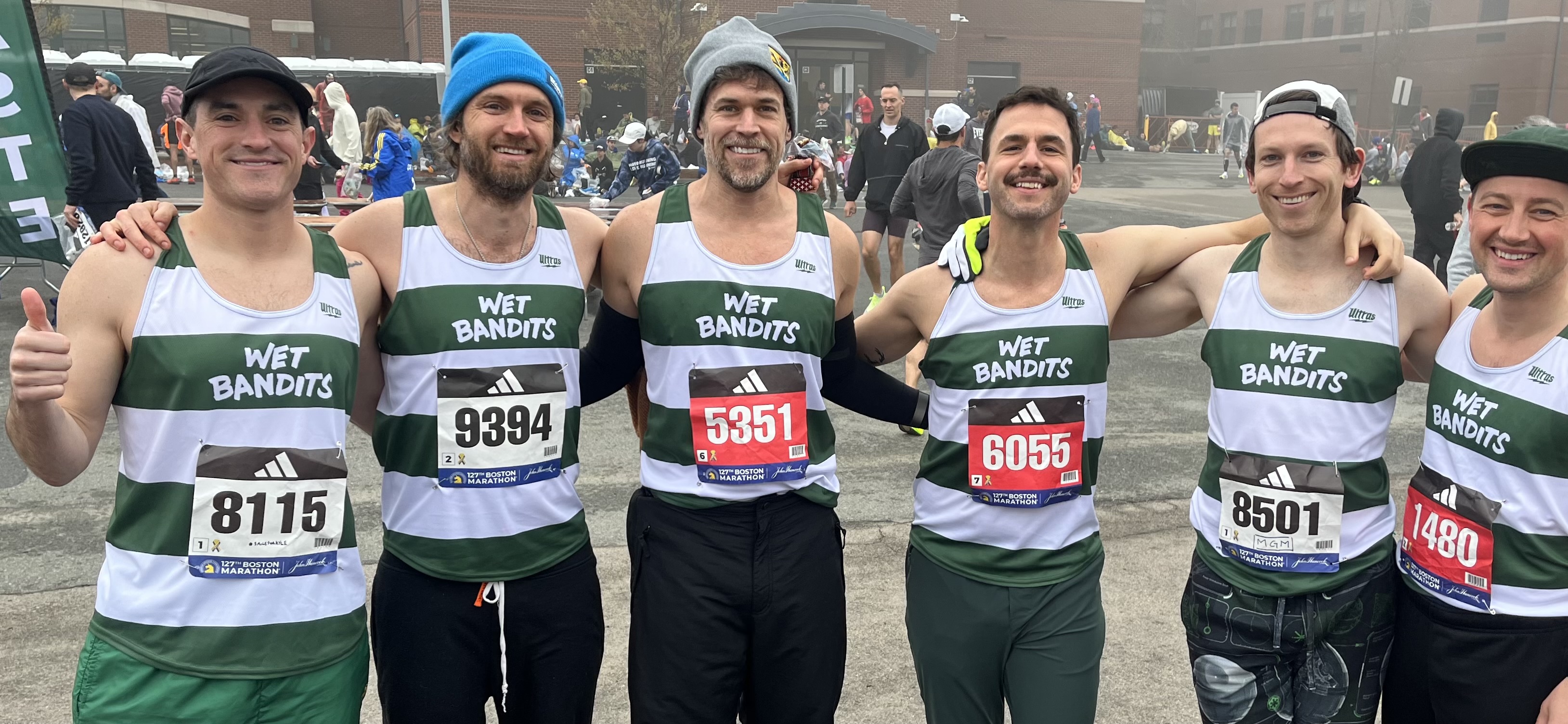 wet bandits run club together at the boston marathon